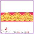 Notable yellow dyed wavelike design swiss lace trim